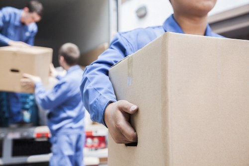 Removal team helping a Stratford home move with boxes and furniture