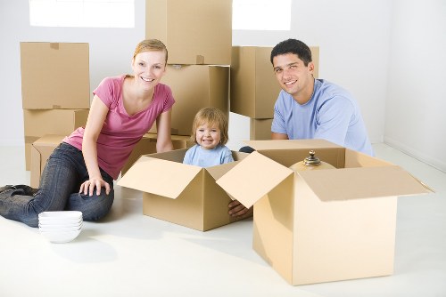 Packed office furniture and equipment prepared for a Stratford commercial move