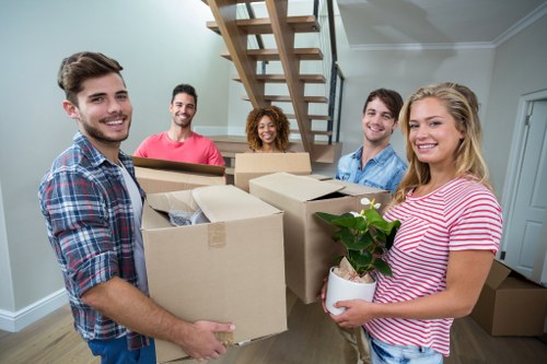 Removal team planning a move in Stratford near apartment buildings and busy streets