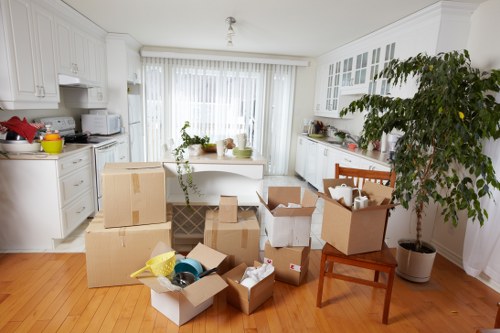 Packed moving boxes and household items ready for transport in Stratford