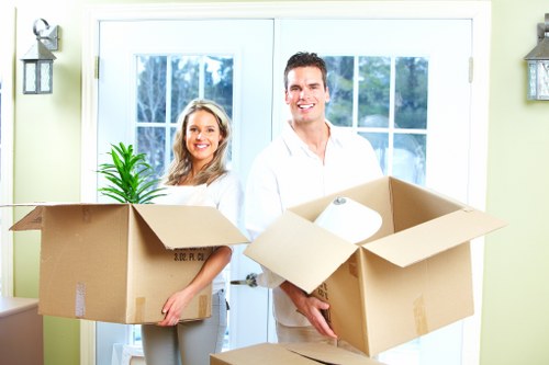 Packed moving boxes and furniture ready for local Stratford relocation