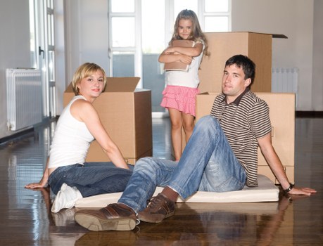 Preparing a Stratford flat move with labelled boxes and protective wrapping